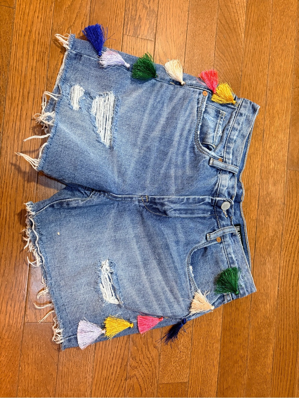 Blank NYC Blue Distressed Denim Shorts with Multicolor Tassels